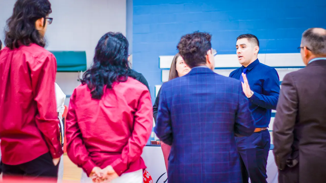 Professor Manny Galvan speaking to a group of instructors during an instructor workshop